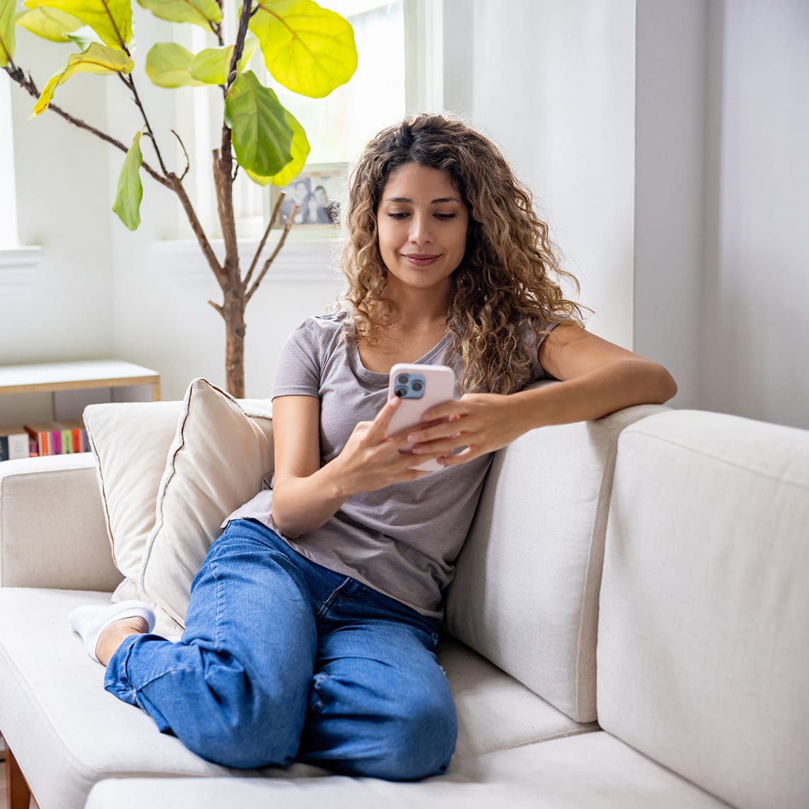 latino woman using cell phone