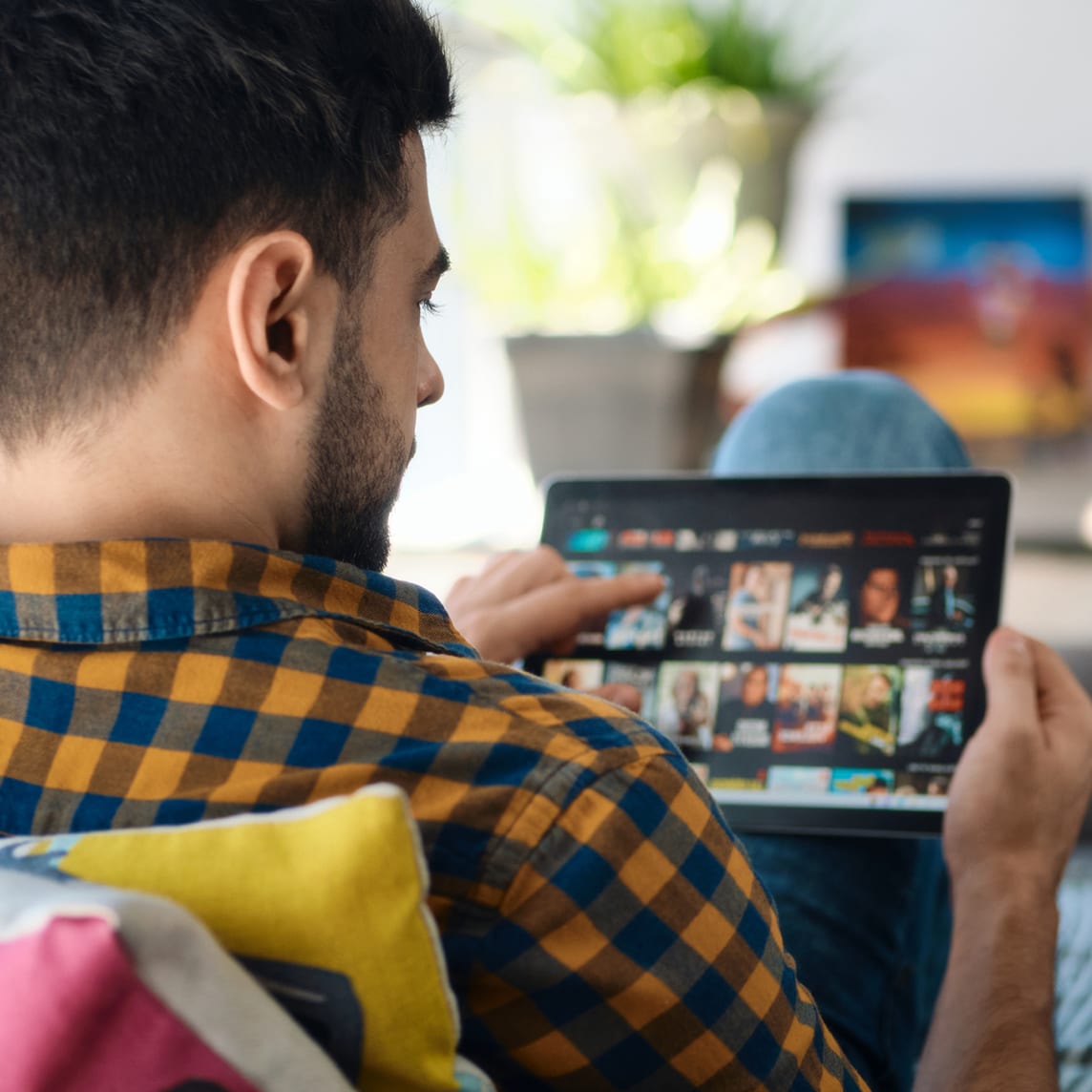 man streaming a show with at&t internet