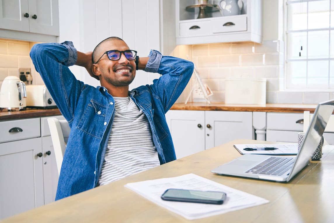 Young man taking a break while working at home