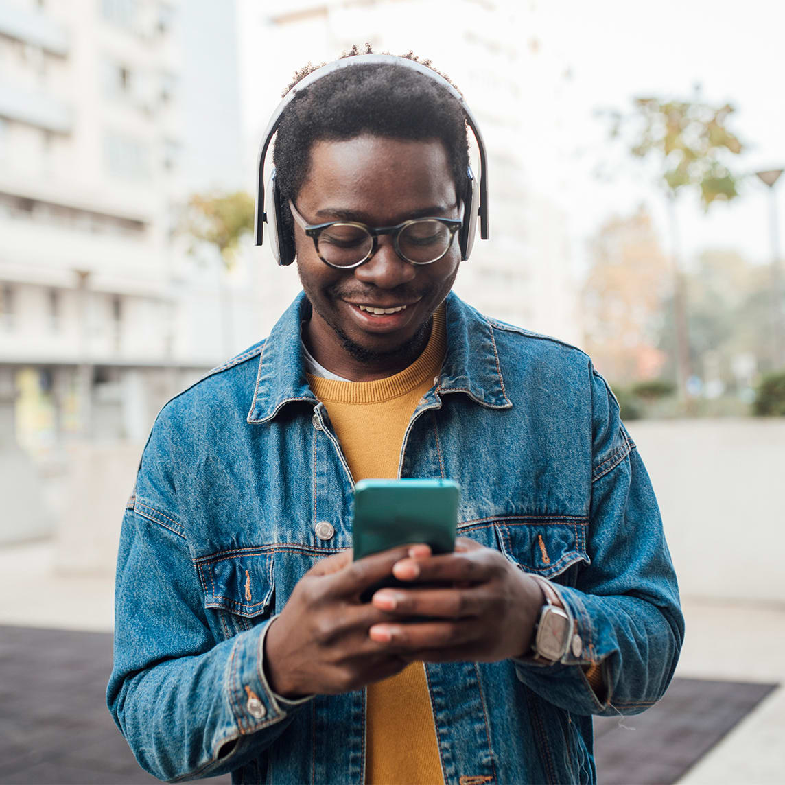 young adult listening to streaming music on phone